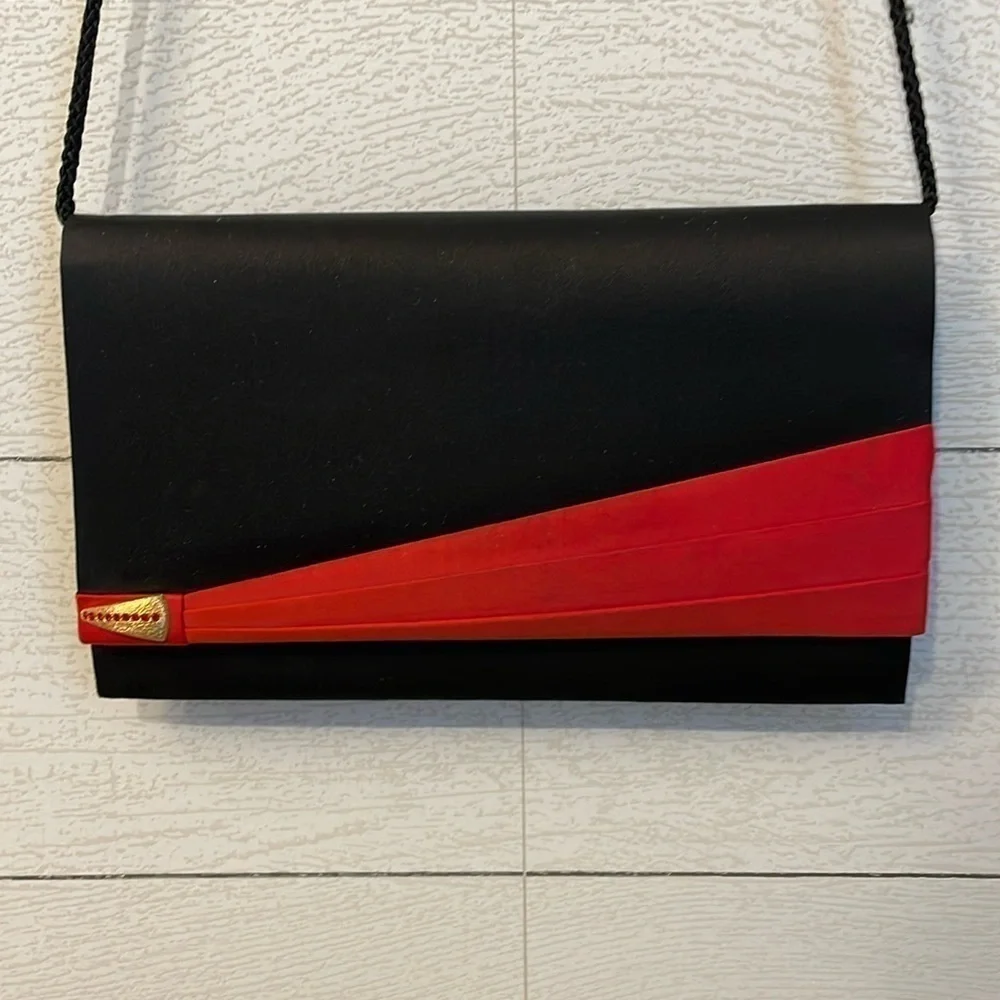 Black and red retro 80's or 90's vintage women's purse with magnetic clasp party